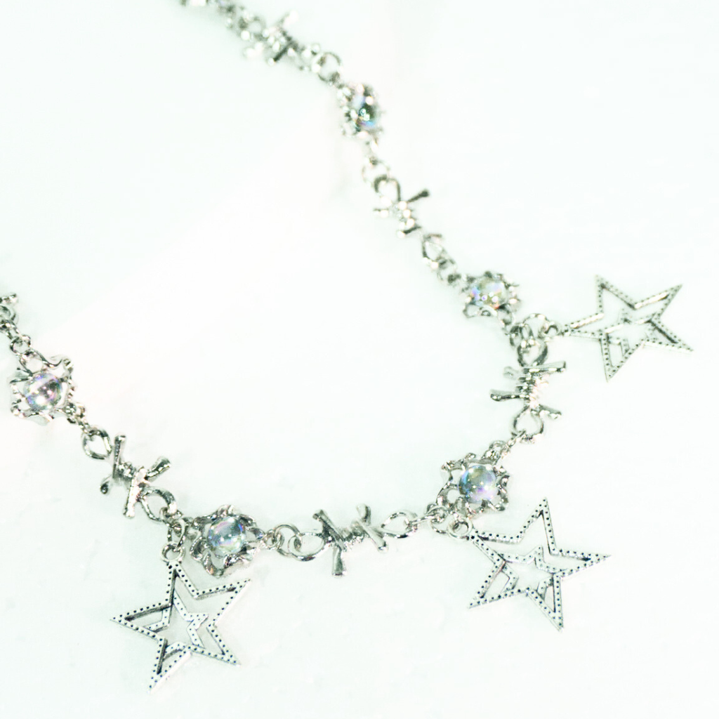 COLLAR CON DIJES DE ESTRELLAS